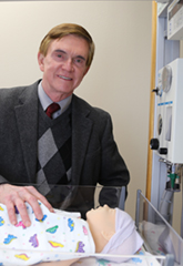 Richard Jordan, MD, with infant manikin in SimCentral