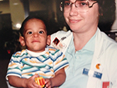 Patti Patterson, MD, MPH, (Family Medicine Resident '83) holds 2-year-old Thomas Freeman in 1984.