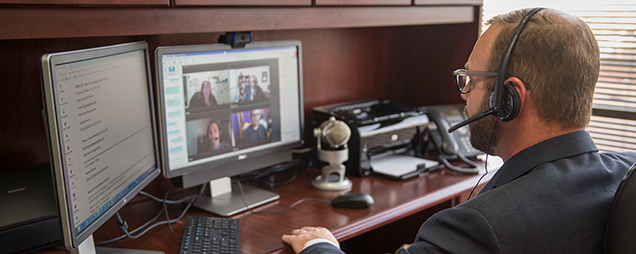 Faculty member video conferencing with 4 students