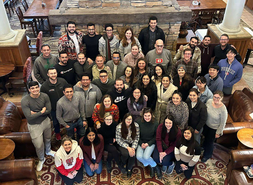 Group of TTUHSC Internal Medicine Resident's in a lodge looking up smiling
