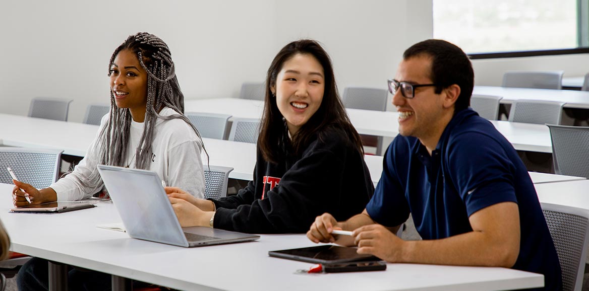 School of Medicine students sitting at a desk in a classroom