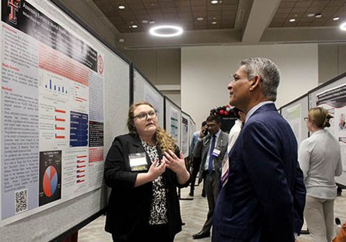 SOM student presenting poster