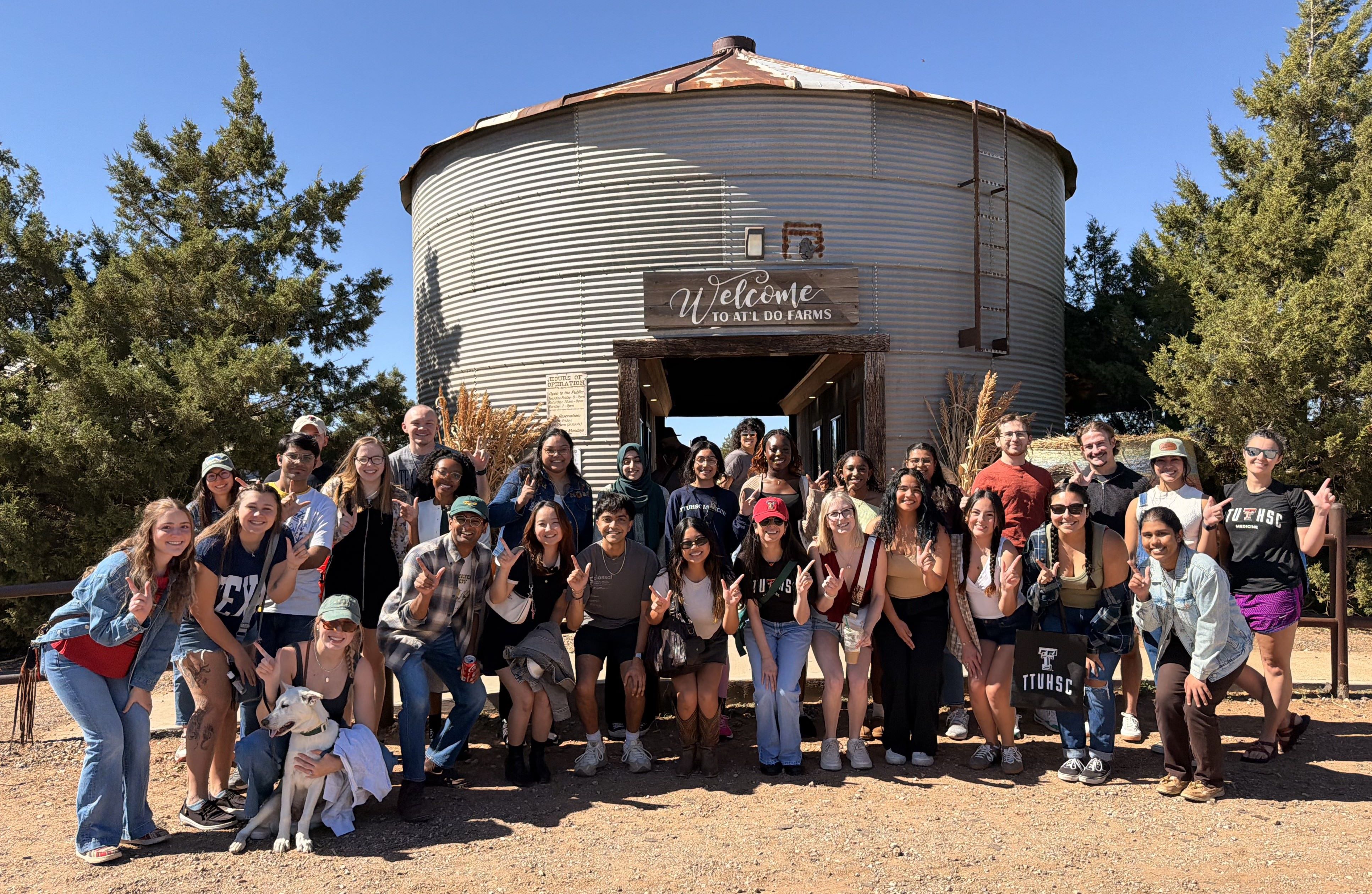 Students in front of the entrance to the At'l Do Corn Maze